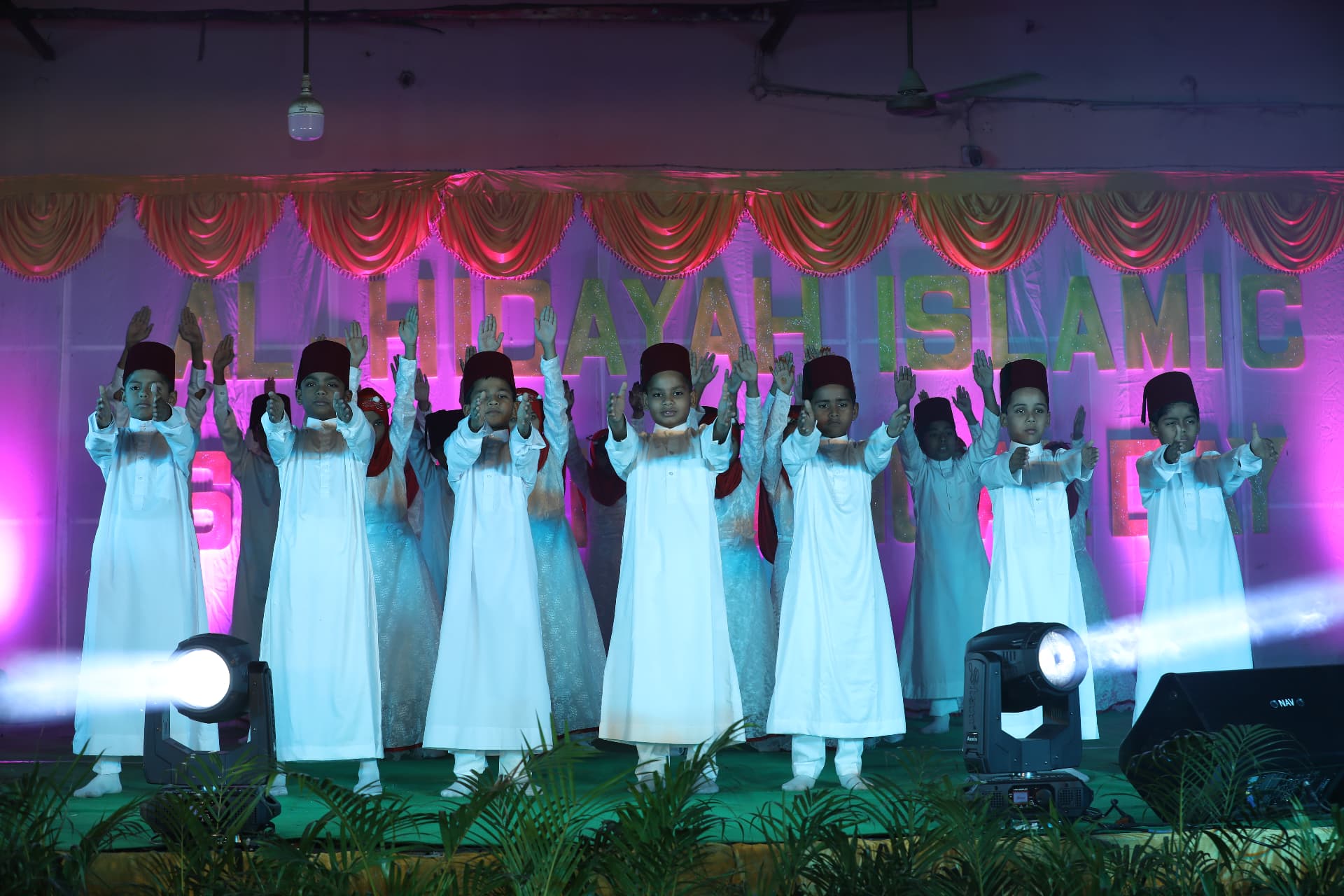 Students performing on stage at Annual Day